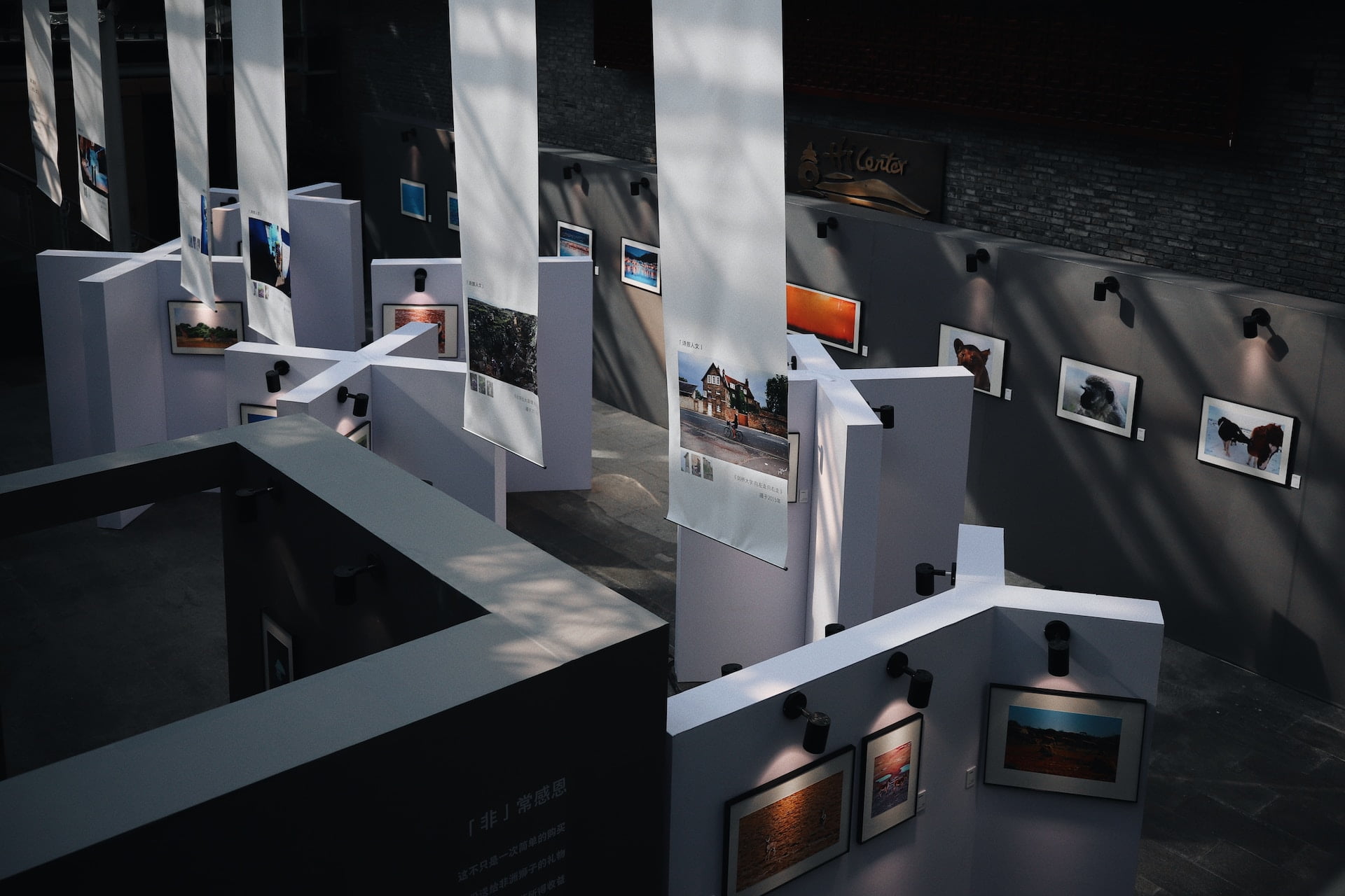 Depicts several paintings arranged in a gallery. Used as a cover image for art, collectibles, and culture as an asset class.